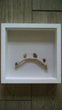 Pebble Art - Birds on a Branch. These sweet little pebble birds look so cute perched upon their branch.