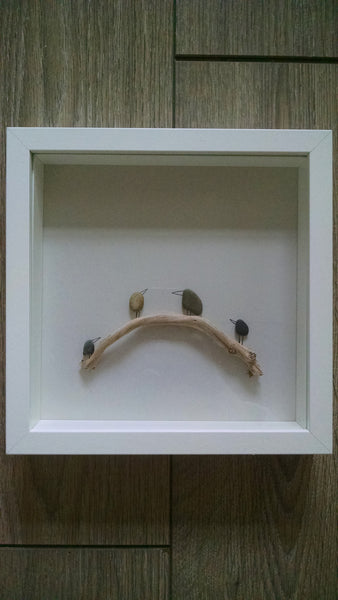 Pebble Art - Birds on a Branch. These sweet little pebble birds look so cute perched upon their branch.