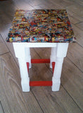 Marvel Stool. With a serious amount of sanding, a lick of paint and transferring a marvel collage onto it using the decoupage technique, it has been completely transformed and been given a new lease of life. Could also be used as a little side table 